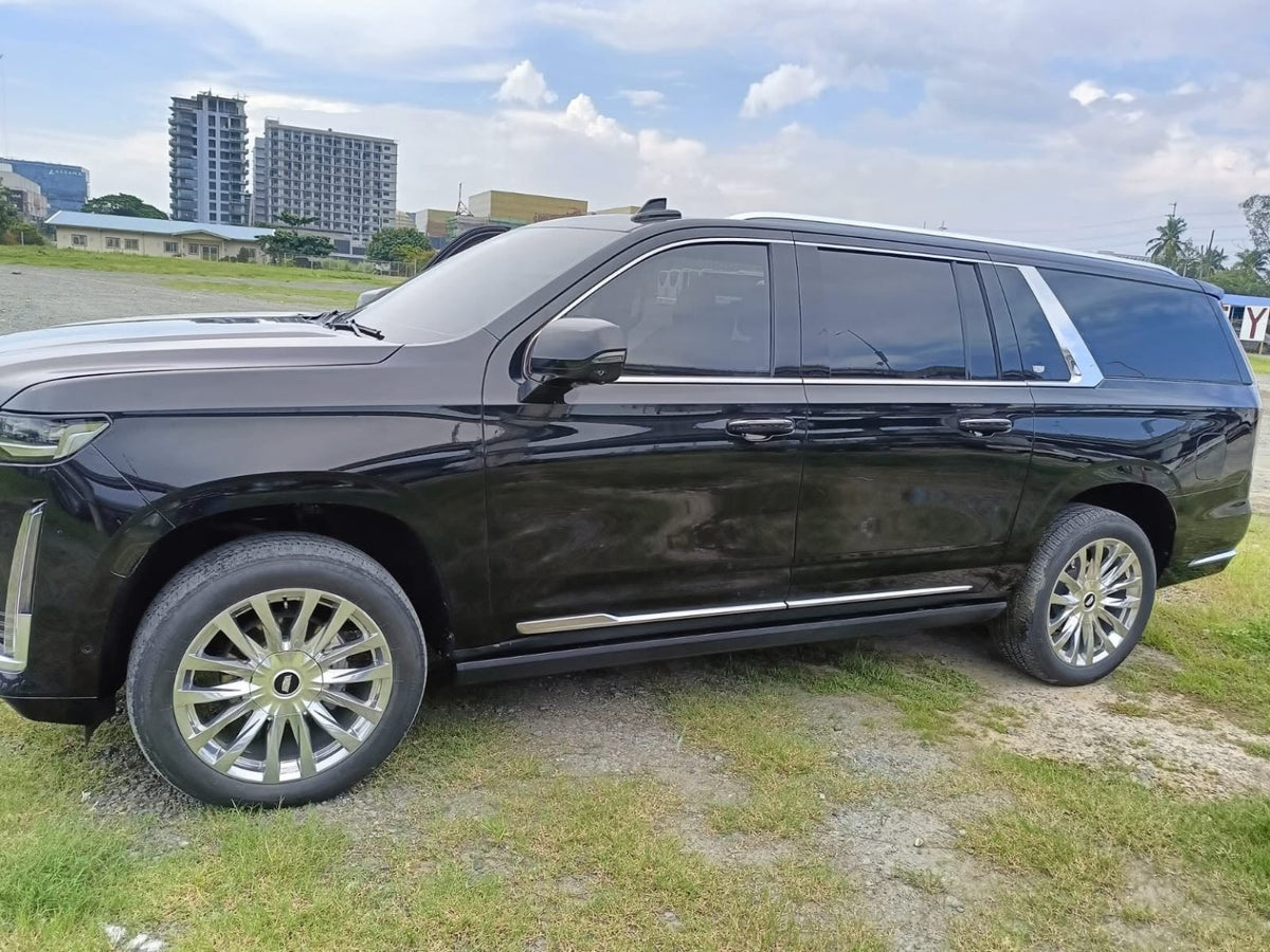 Side profile of the black Cadillac Escalade 4x4